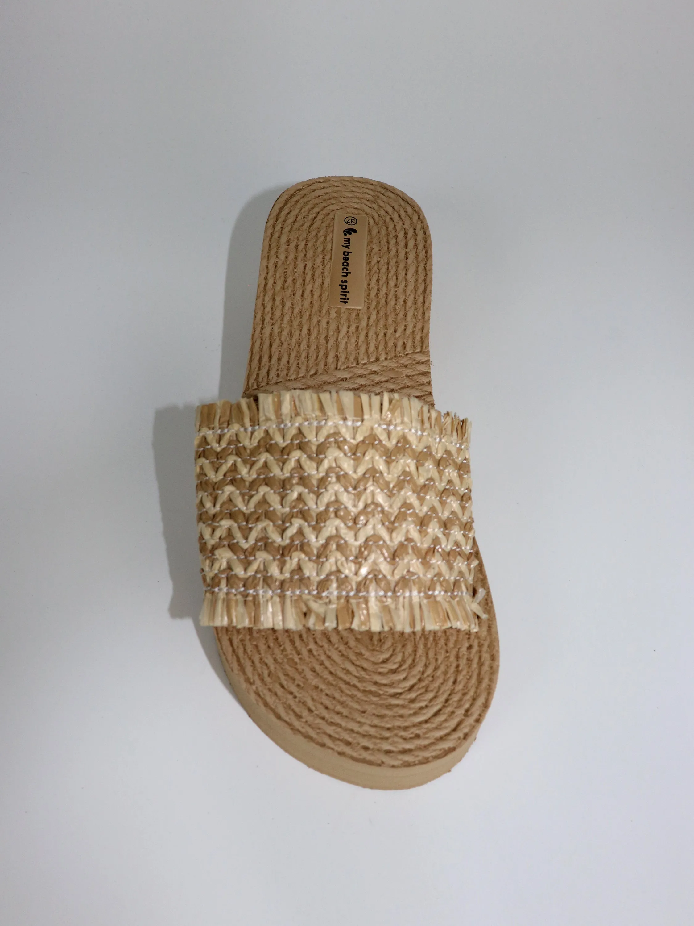 Heel compensed beach slipper