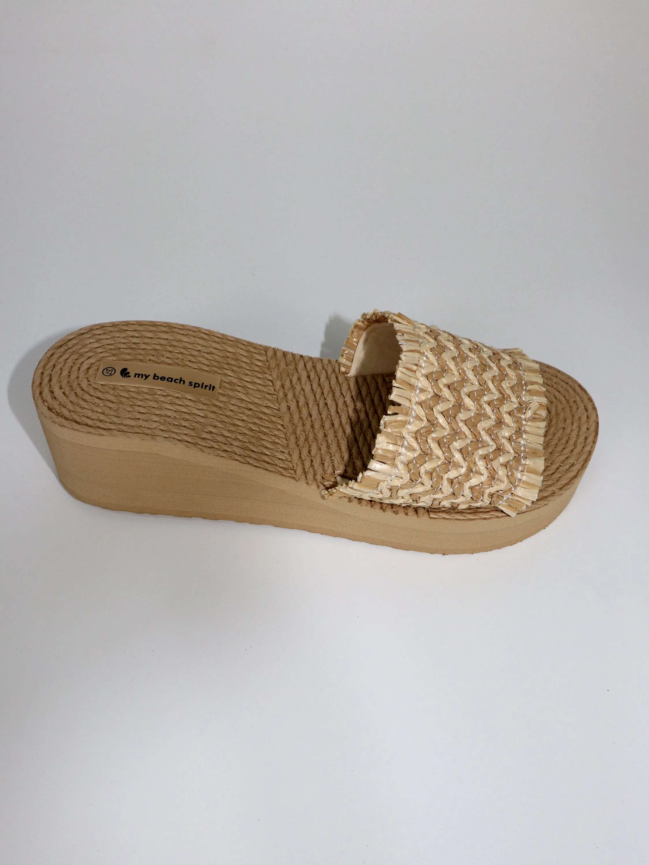 Heel compensed beach slipper